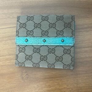 Gucci brown monogram canvas and leather studded compact wallet